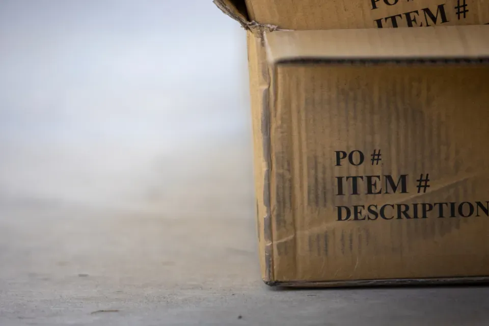 Shipping carton marked with PO number, item number and description