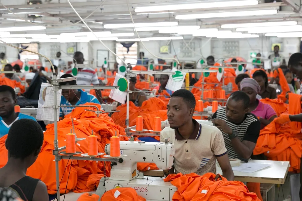 Garment factory floor with workers at sewing machines