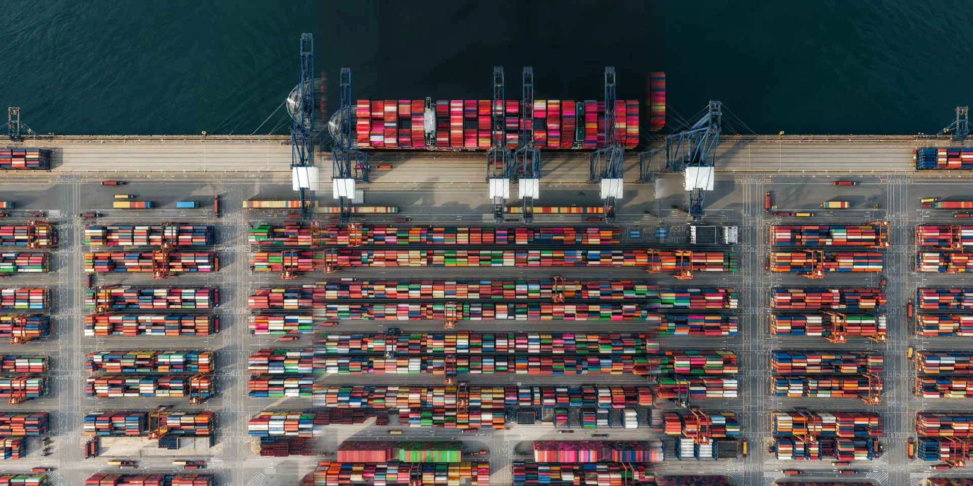 A quay with cranes and containers, seen from above